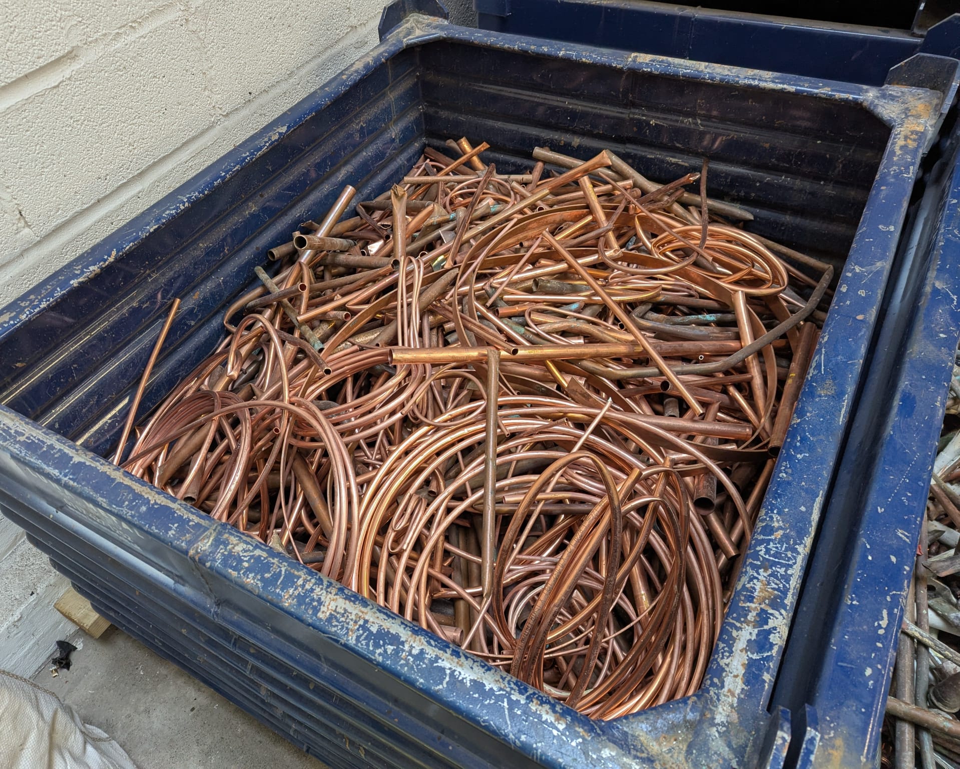 Copper scrap metal in collection bin